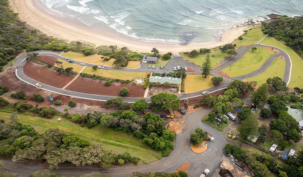 Aerial view of the campsites, the beach and the access road at Point Plomer campground. Credit: John Spencer &copy; DCCEEW