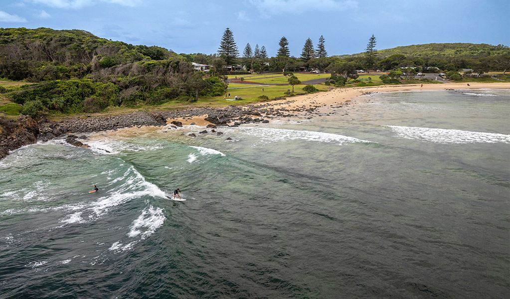 Aerial view of surfers, Point Plomer campground in the distance. Credit: John Spencer &copy; DCCEEW