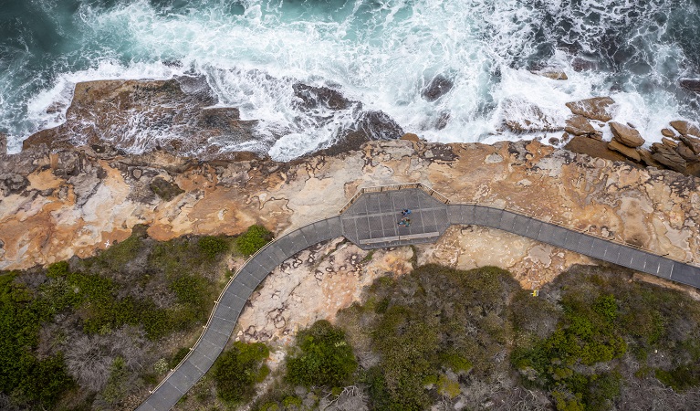 Aerial view of waves crashing against the cliffs, Malabar Headland National Park. Photo: John Spencer &copy; DPE