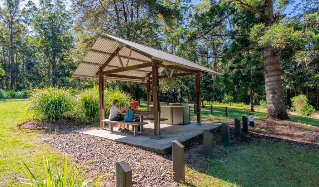 Campers sitting at the picnic shelter at Cutters Camp campground. Credit: John Spencer &copy; DPE 