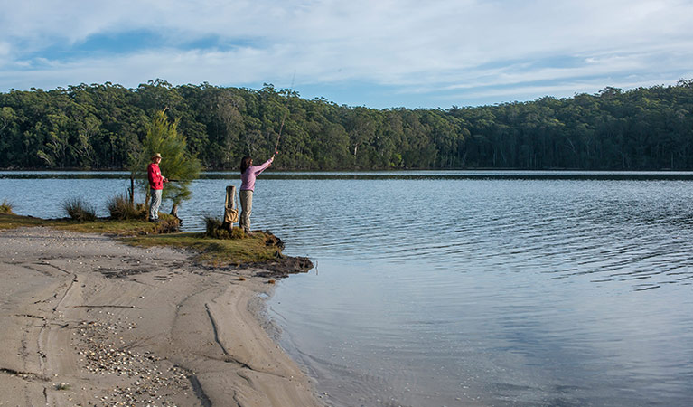 Couple fishing on Burrill Lake, Giriwa walking track, Meroo National Park. Photo: Michael Van Ewijk &copy; OEH