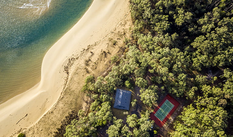 Ariel view of Myer House, tennis court and beach at Mimosa Rocks National Park. Photo: OEH/John Spencer