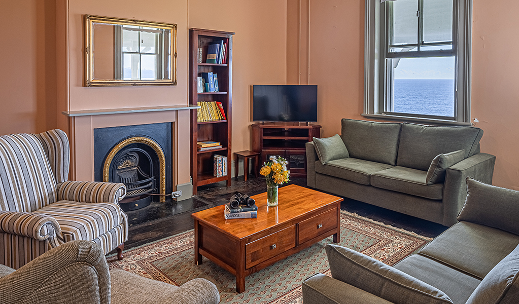 The cosy lounge room at Montague Island Assistant Lighthouse Keeper's Cottage. Photo &copy; David Rogers/DPE