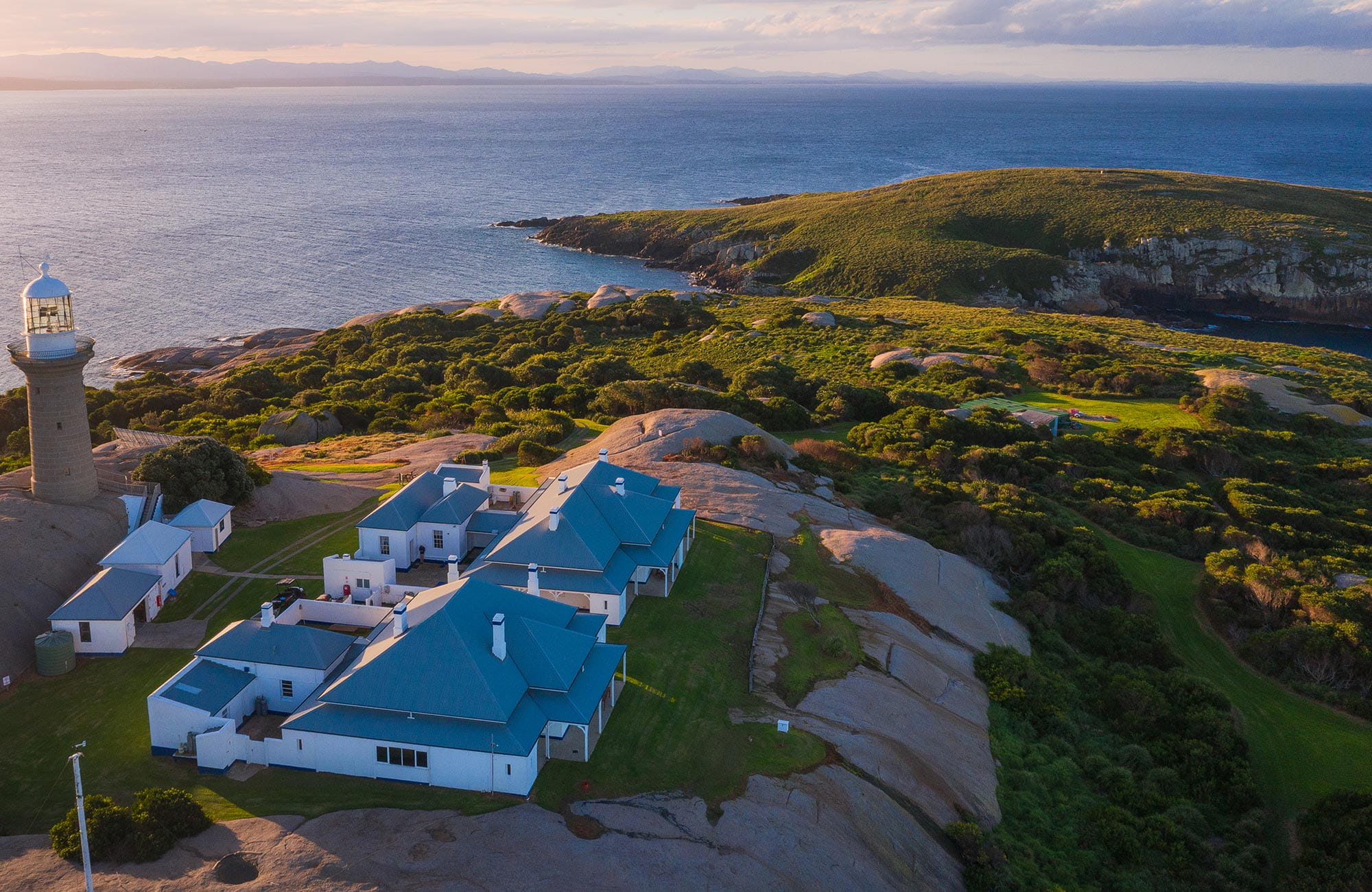 Aerial view of Montague Island lighthouse and cottages at sunset, Montague Island Nature Reserve. Photo: Daniel Tran/OEH