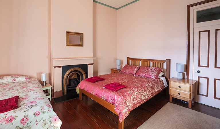 Queen bed and king single bed in bedroom at Montague Island Head Lighthouse Keepers Cottage. Photo: Daniel Tran/OEH