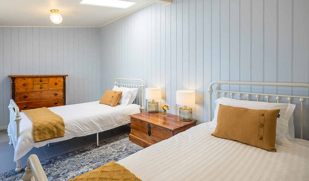 Twin beds in a bedroom at Montague Island Head Lighthouse Keeper's Cottage. Photo: David Rogers/DPE