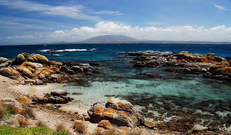 View of rocky bay and views across sea to Gulaga, from Barunguba Montague Island Nature Reserve. Photo: Stuart Cohen &copy; OEH/Stuart Cohen