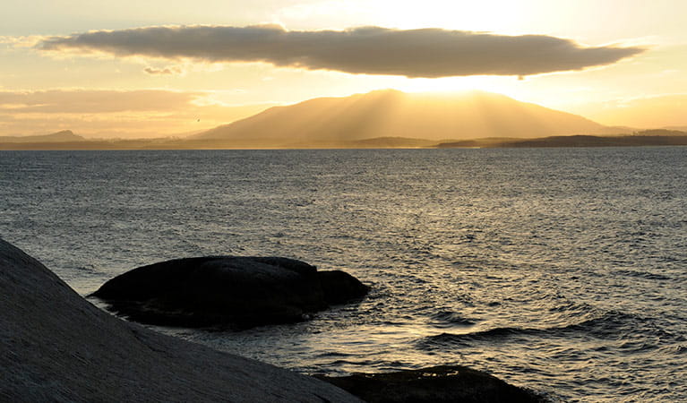View of sunset over Gulaga mountain, near Narooma, seen from Montague Island. Photo: Stuart Cohen/OEH