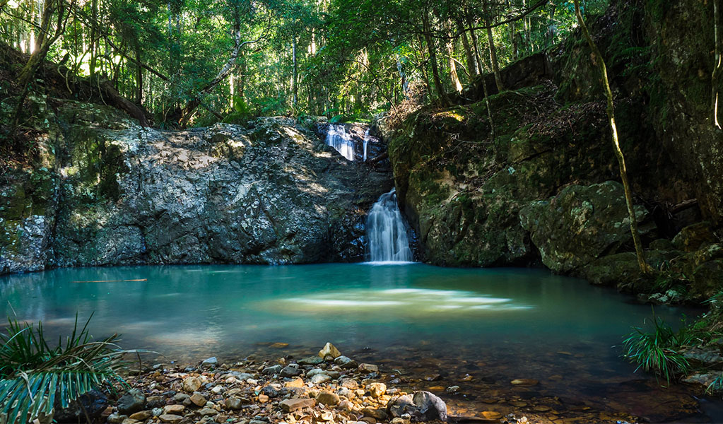 Unicorn Falls cascading into the pool at its base, Mount Jerusalem National Park. Photo: Dean Trezise &copy; Dean Trezise