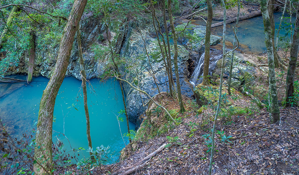 Aerial view of Unicorn Falls cascading into the pool at its base, Mount Jerusalem National Park. Photo: Dean Trezise &copy; Dean Trezise