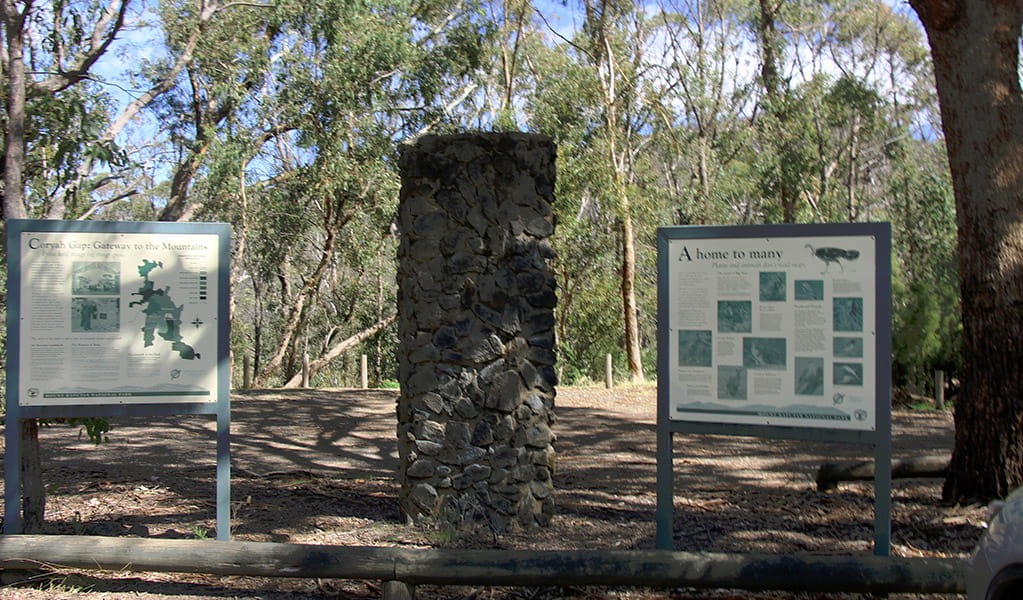 Stone column with NPWS information panels in an open bushland setting. Photo &copy; Jessica Stokes