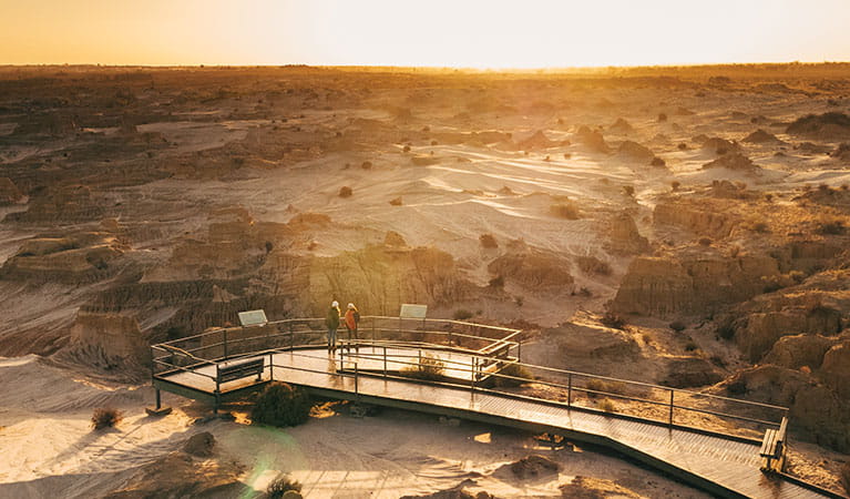 Two girls stand at Red Top lookout boardwalk, Mungo National Park. Photo: Melissa Findley/OEH 