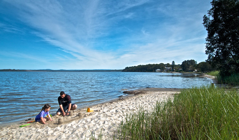 Family playing on the river bank, Elizabeth Bay. Photo: John Spencer &copy; DPIE