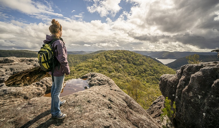 Woman standing at Point Loop lookout, Muogamarra Nature Reserve. Photo: John Spencer/DPIE