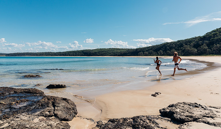 A couple at North Durras Beach, Burrawang walking track, Murramarang National Park. Photo: Melissa Findley