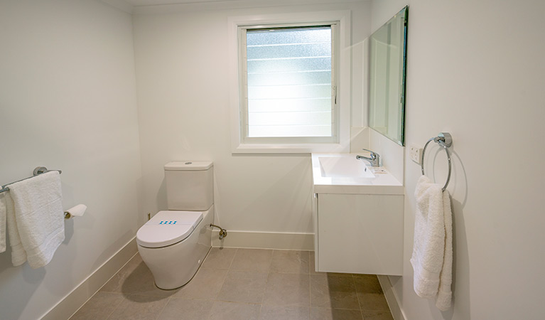 Judges House bathroom with modern basin and toilet, Murramarang National Park. Photo: John Spencer &copy;DPIE