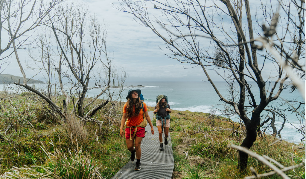 2 bushwalkers on Murramarang South Coast Walk, walking from Pretty Beach to Pebbly Beach. Credit: Remy Brand &copy; Remy Brand