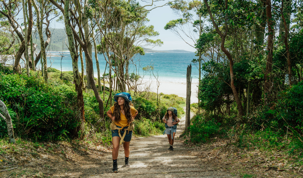 2 walkers setting off on the walk from Depot Beach. Credit: Remy Brand © Remy Brand