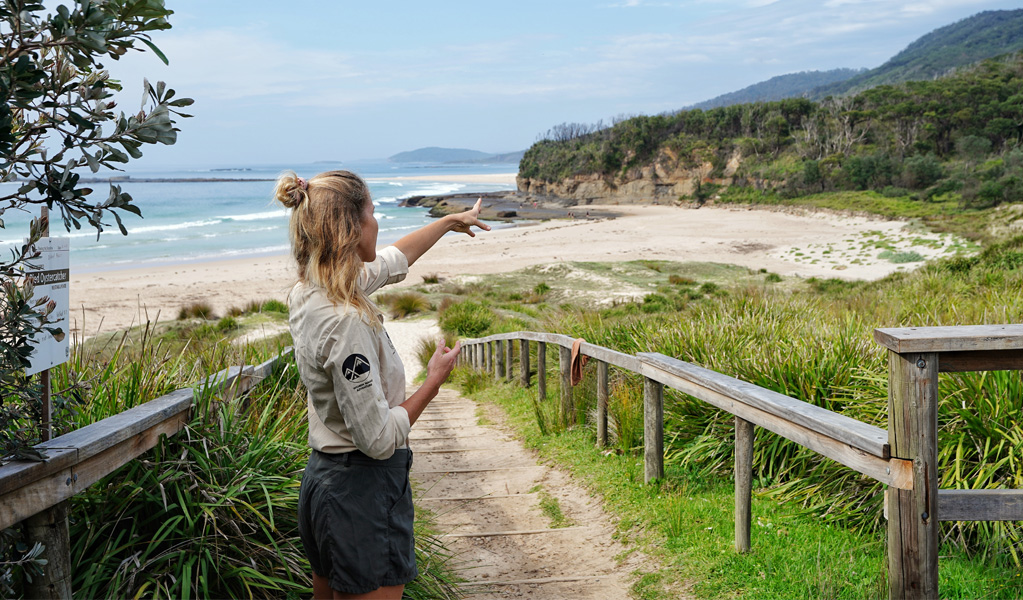 A Women Want Adventure tour guide at Pretty Beach. Credit: Women Want Adventure