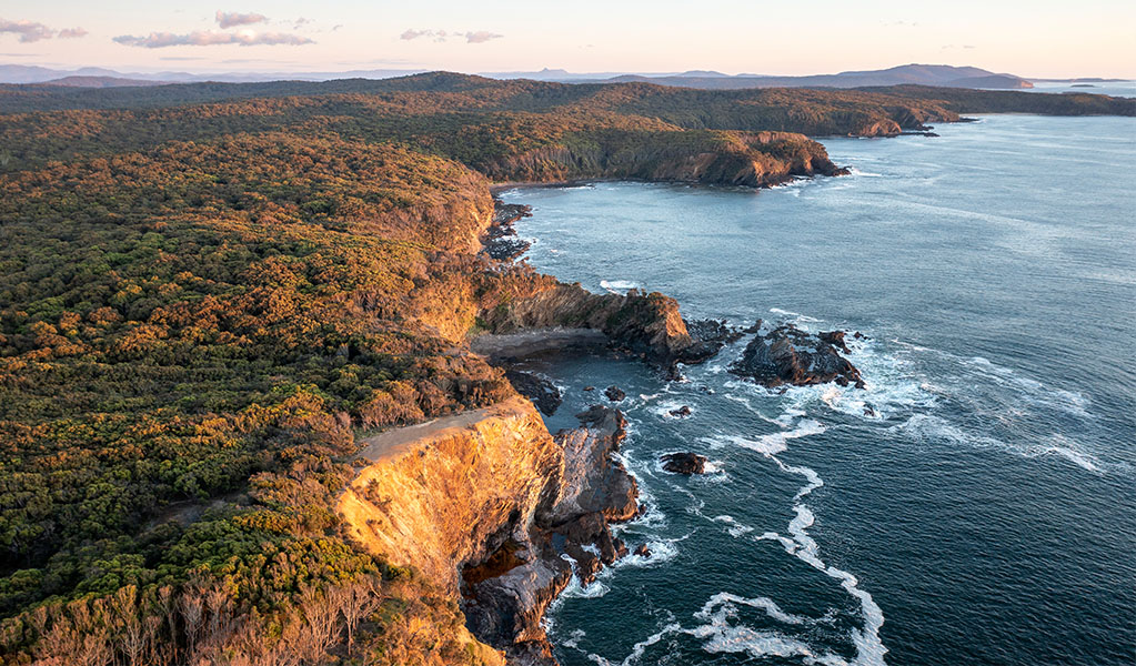 Aerial view of the coastline at sunset, Murramarang National Park. Credit: John Spencer © DPE