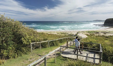 Couple enjoying views over Pretty Beach on the NSW South Coast. Photo credit: David Finnegan &copy;DPIE