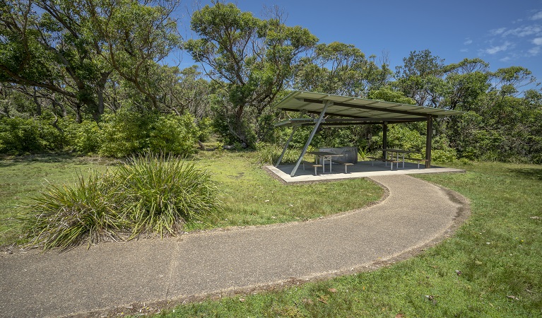 Covered picnic tables at Pretty Beach picnic area. Photo credit: John Spencer &copy; DPIE