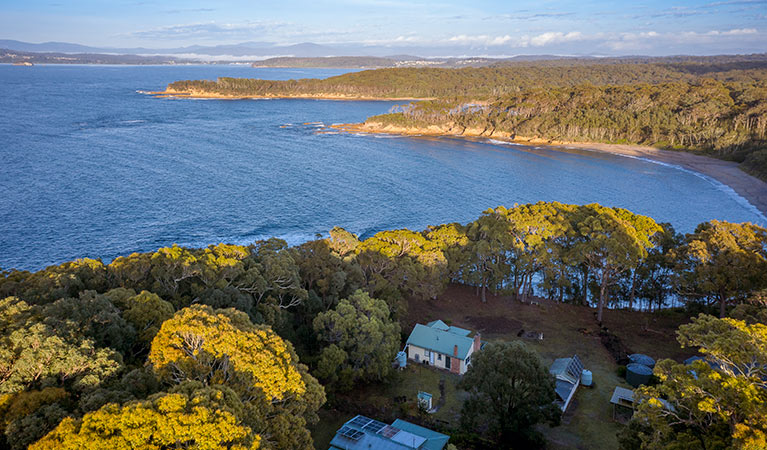 Aerial view of Yellow Rock Beach House, the ocean and headlands. Photo: John Spencer &copy; DPIE