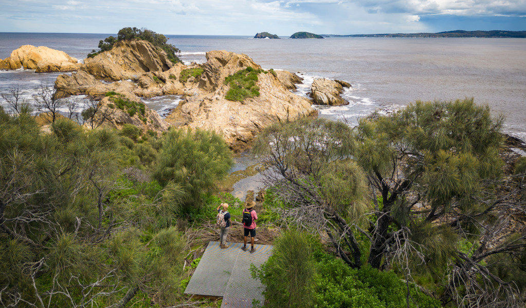 People on a lookout near Yellow Rock in Murramarang National Park. Credit: John Spencer &copy;DPE