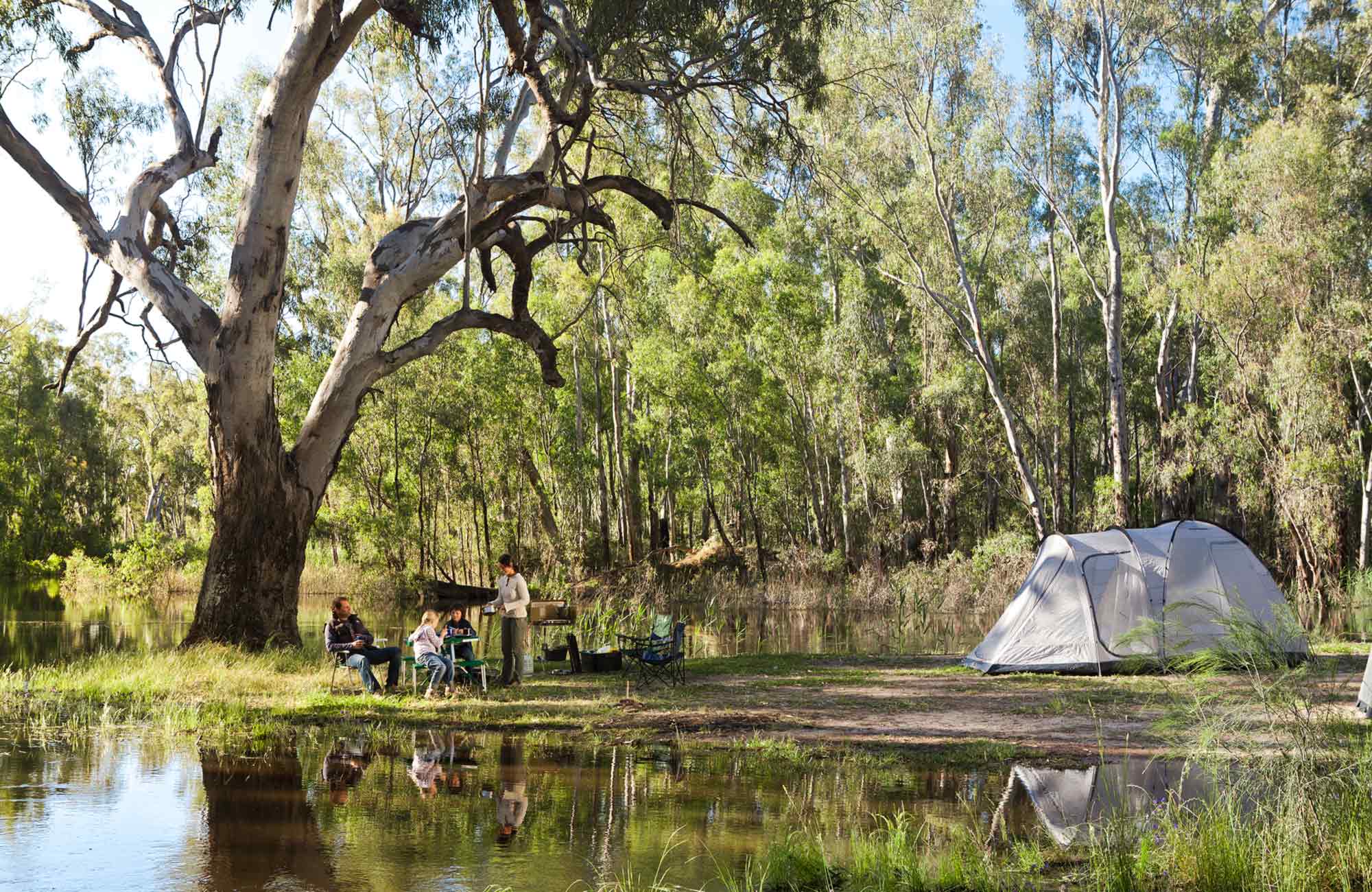 People camping by the river. Photo:David Finnegan