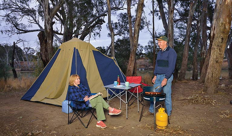 2 people camping at Benarca campgrounds in Murray Valley Regional Park. Photo: Gavin Hansford/NSW Government