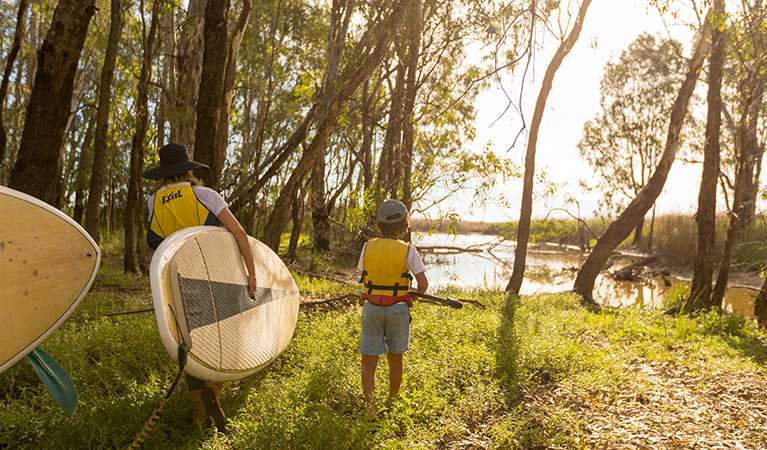 Paddlers take their gear to the shore of Barmah Lake, Barmah National Park. Photo: B Ferguson/OEH