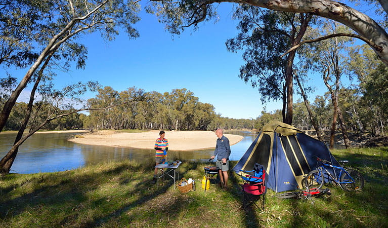 A couple next to their tent, camping on the banks of the river at Murrumbidgee Valley campgrounds. Photo: &copy; Gavin Hansford