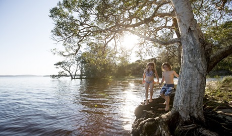 Children playing by the lake, Myall Lakes National Park. Photo: Nolan Verheij-Full