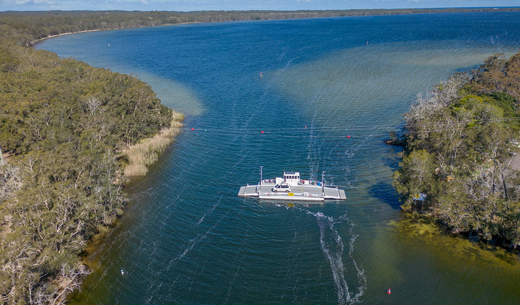 An aerial photo of Bombah Point car ferry, crossing the lake in Myall Lakes National Park. Credit: John Spencer &copy; DPE