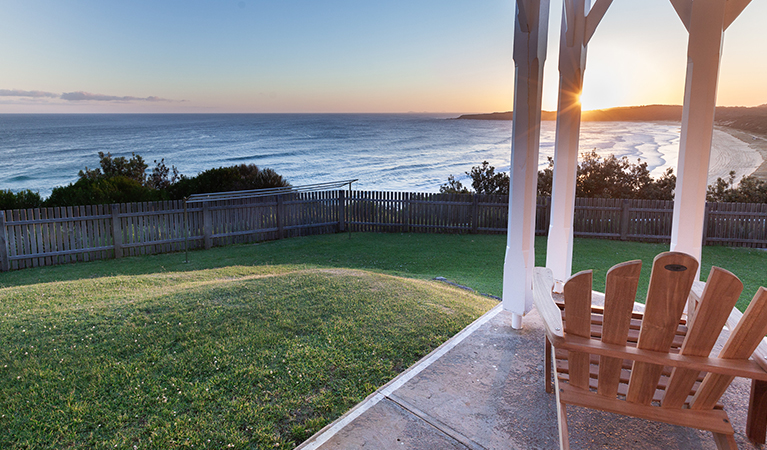 Sunset over the ocean from Head Keeper's cottage verandah in Myall Lakes National Park. Photo: Seal Rocks Lighthouse Cottages