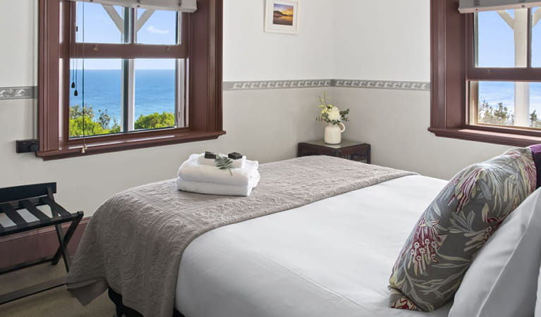 Main bedroom in Head Keeper's cottage with 1 queen bed. Photo: Seal Rocks Lighthouse Cottages