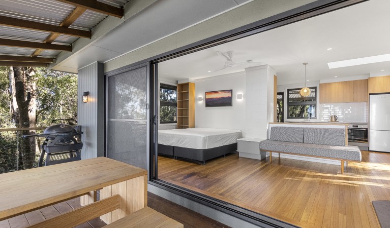 View of the interior of The Chalet from the deck in New England National Park. Photo: Mitchell Franzi &copy; DPIE