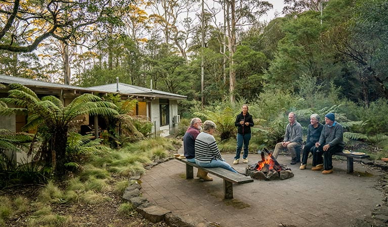 Group of friends sititng around the fire pit at The Residence in New England National Park. Photo: John Spencer &copy; OEH