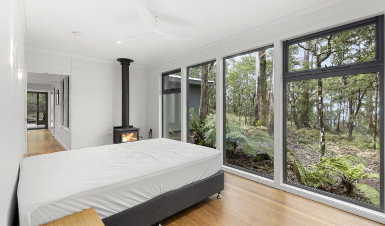 A bedroom at The Residence with views of the surrounding bushland in New England National Park. Photo: Mitchell Franzi &copy; DPIE