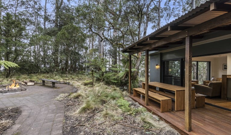 The deck with benches and a table at The Residence, New England National Park. Photo: Mitchell Franzi &copy; DPIE