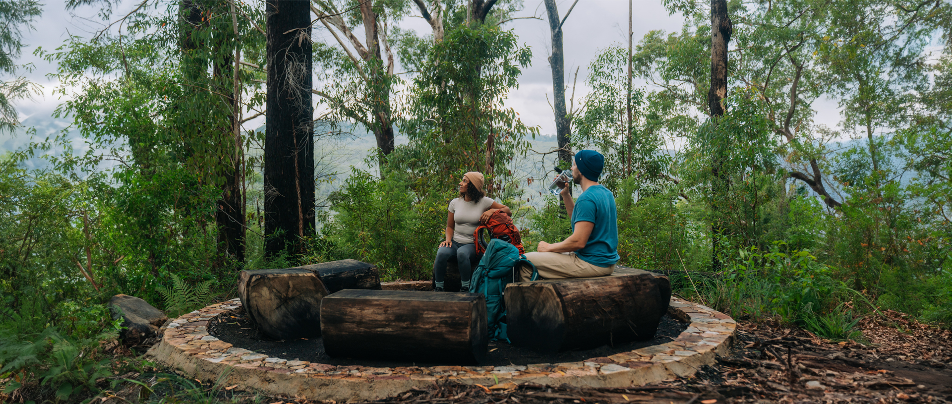 Walkers sitting at the yarning circle at Weeun Weeun campground. Credit: Remy Brand/DCCEEW © Remy Brand