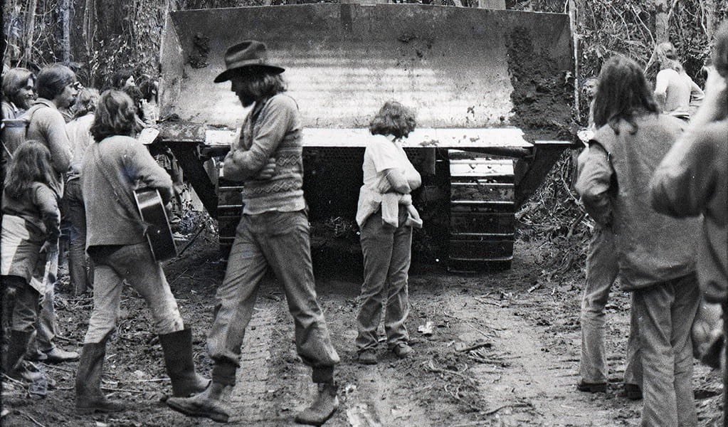 Protestors physically block a bulldozer at Terania Creek, in what was to become Nightcap National Park, in the early 1980s. Photo: David Kamp &copy; David Kamp
