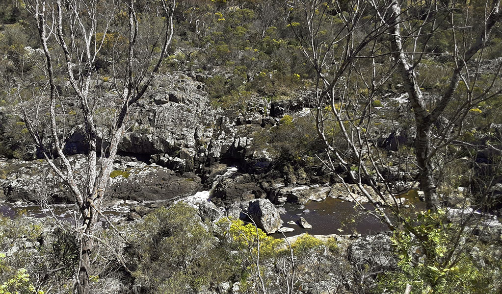 View of a river coursing through a dry and rocky landscape in Oxley Wild Rivers National Park. Photo credit: Josh Armitage &copy; DPIE