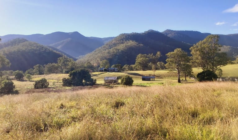East Kunderang Homestead against the backdrop of the mountains and valleys of Oxley Wild Rivers National Park. Photo: Leah Pippos &copy; DPE