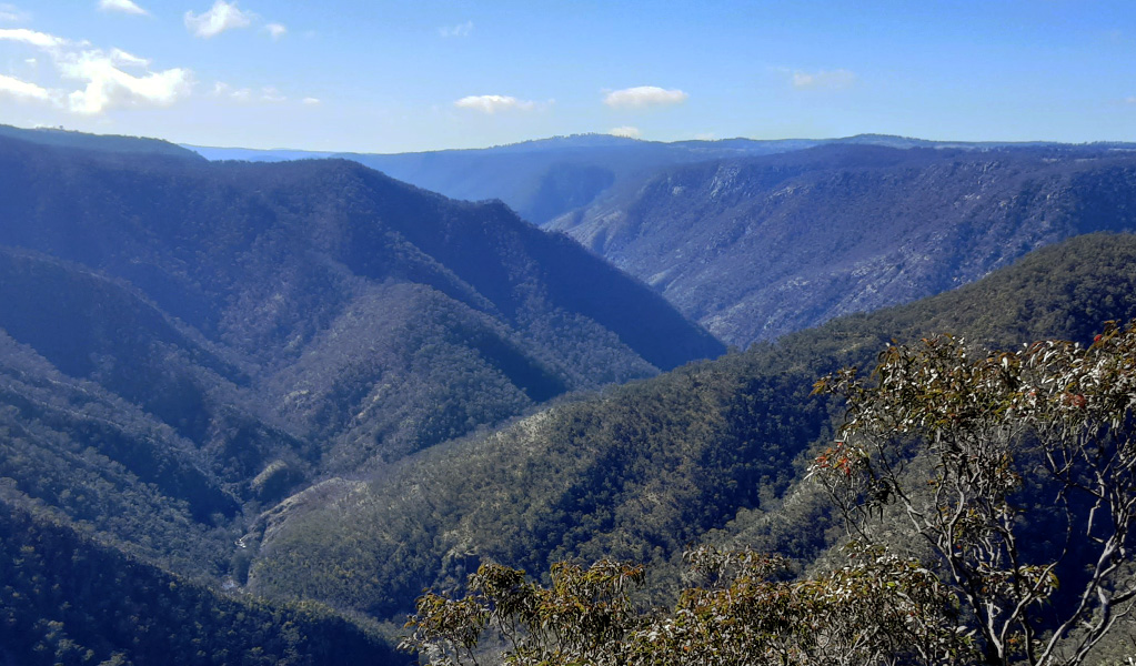 View of a river set in a landscape of steep valleys and ridges. Photo credit: Josh Armitage &copy; DPIE