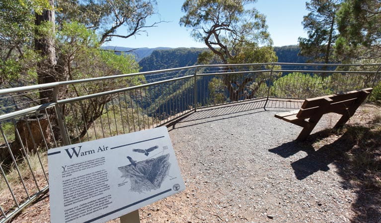 Sign and bench at Tia Falls lookout. Photo &copy; Rob Cleary