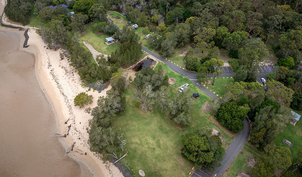 An aerial view of Bonnie Vale campground and parking in Royal National Park. Credit: John Spencer/DCCEEW  &copy; DCCEEW