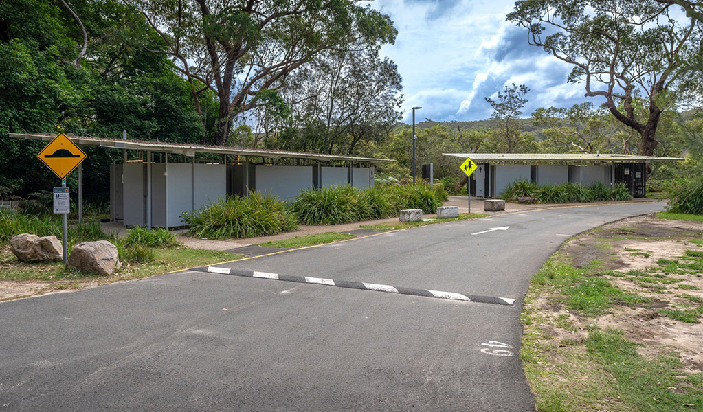 Picnic shelter and picnic tables in Bonnie Vale campground in Royal National Park. Photo: Andrew Elliot &copy; DPE