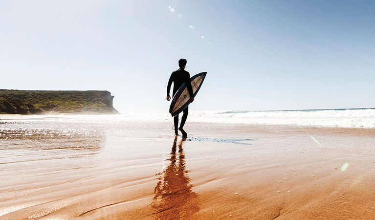 Surfer at Garie beach in Royal National Park. Photo: David Finnegan/OEH