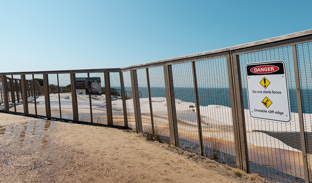 NPWS has had to build a large, permanent safety fence around Wedding Cake Rock in Royal National Park as many visitors have been injured here.  Photo: DPIE &copy; DPIE